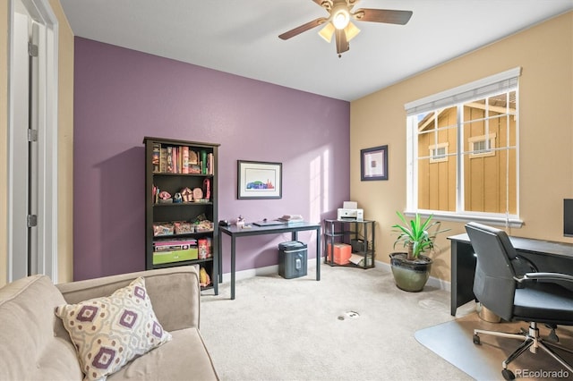 office space with carpet flooring, baseboards, and ceiling fan