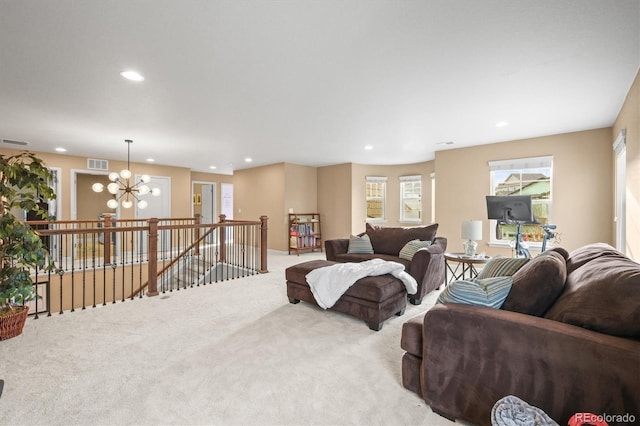 living room featuring recessed lighting, visible vents, carpet floors, and a chandelier