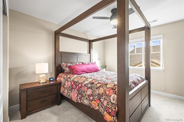 bedroom with light carpet, visible vents, a ceiling fan, and baseboards