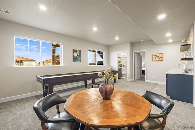 dining room featuring light carpet, visible vents, recessed lighting, and baseboards