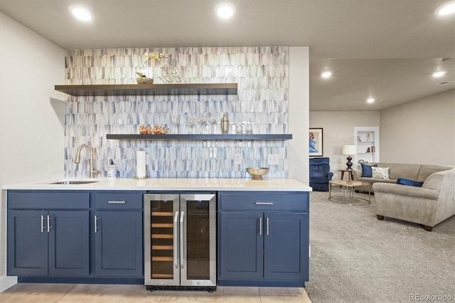 bar featuring beverage cooler, wet bar, recessed lighting, a sink, and light carpet