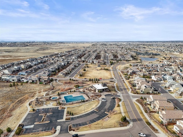 birds eye view of property with a residential view