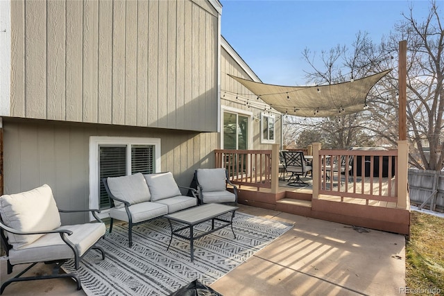 wooden deck with an outdoor living space