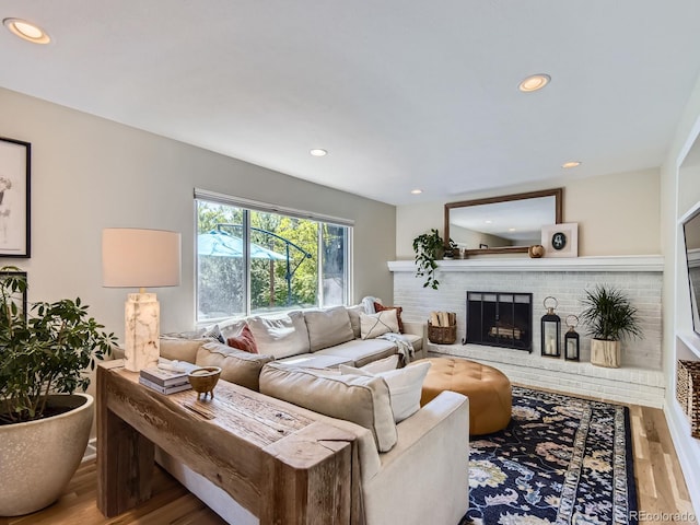 4196 S Reading Way, Denver, CO 80237 - living room with wood finished floors, a brick fireplace, and recessed lighting