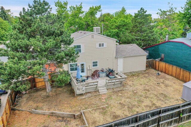4848 S Pitkin Way, Aurora, CO 80015 - rear view of property with a wooden deck, a fenced backyard, and roof with shingles