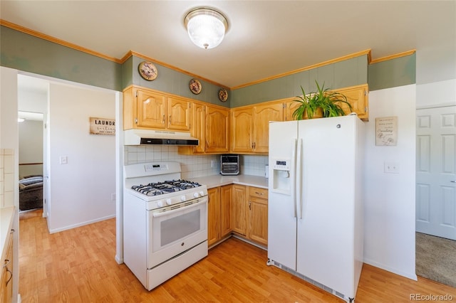 14347 E 134th Ave, Brighton, CO 80601 - kitchen featuring white appliances, under cabinet range hood, light countertops, tasteful backsplash, and light wood-style floors