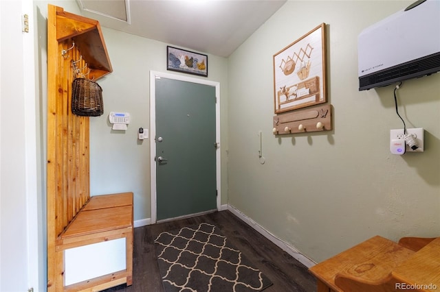 14347 E 134th Ave, Brighton, CO 80601 - doorway to outside featuring dark wood finished floors, baseboards, and a wall mounted AC