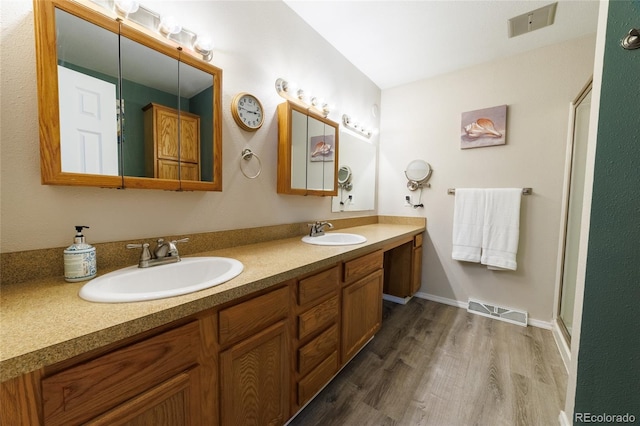 14347 E 134th Ave, Brighton, CO 80601 - bathroom with wood finished floors and double vanity