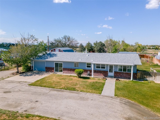 14347 E 134th Ave, Brighton, CO 80601 - ranch-style home featuring an attached garage, brick siding, and concrete driveway