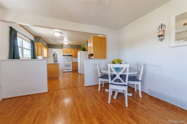 14347 E 134th Ave, Brighton, CO 80601 - dining area featuring light wood-type flooring