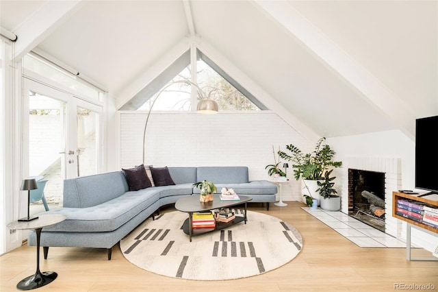 1884 S Ivy St, Denver, CO 80224 - living area featuring wood finished floors, french doors, and a fireplace