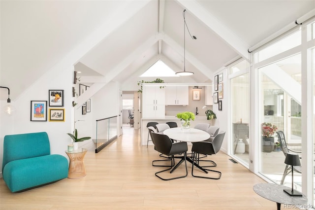 1884 S Ivy St, Denver, CO 80224 - dining space with light wood-style flooring, beam ceiling, and high vaulted ceiling