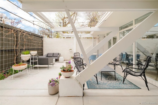 1884 S Ivy St, Denver, CO 80224 - view of patio / terrace featuring an outdoor hangout area and a fenced backyard