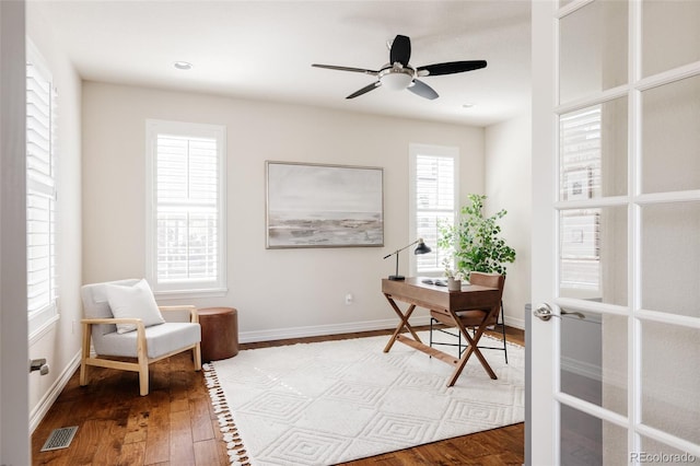 office with wood finished floors, visible vents, french doors, and baseboards