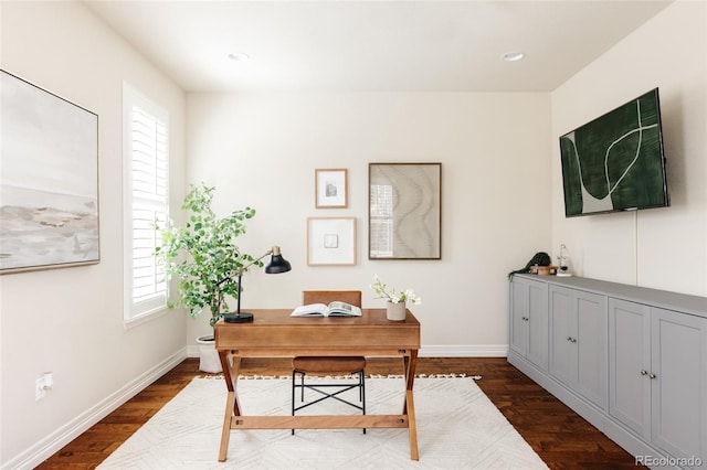 office space featuring recessed lighting, dark wood-type flooring, and baseboards