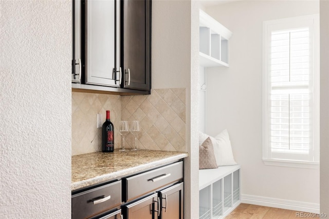 kitchen with decorative backsplash and baseboards