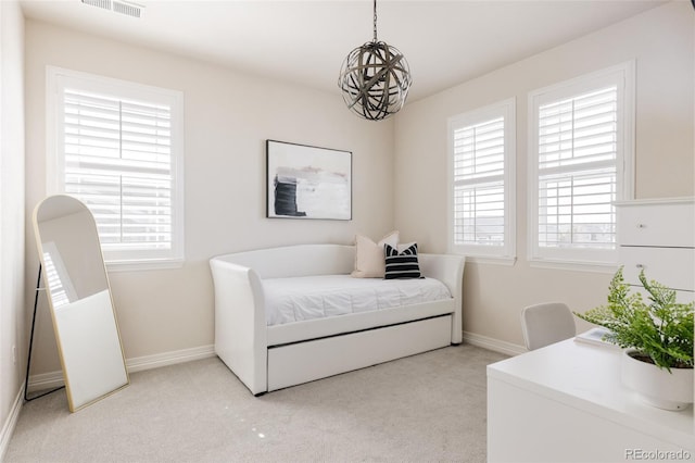 bedroom featuring multiple windows, light colored carpet, and visible vents