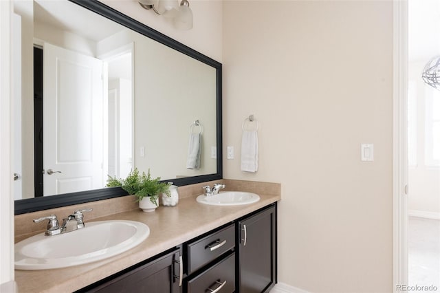 full bath featuring double vanity and a sink