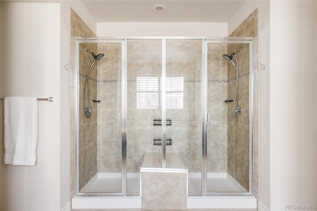 bathroom with a shower stall