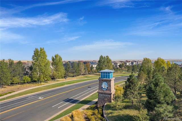 view of road with sidewalks and a residential view