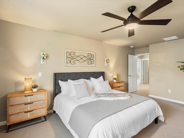 carpeted bedroom featuring visible vents, baseboards, and a ceiling fan