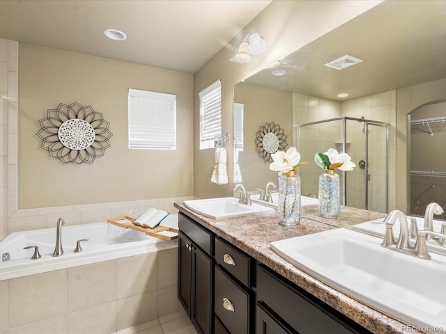 bathroom with a sink, visible vents, a garden tub, and a shower stall