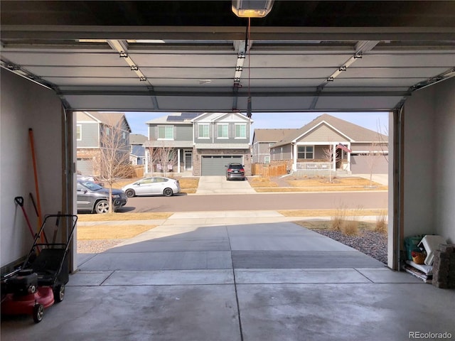 garage featuring a residential view and a garage door opener