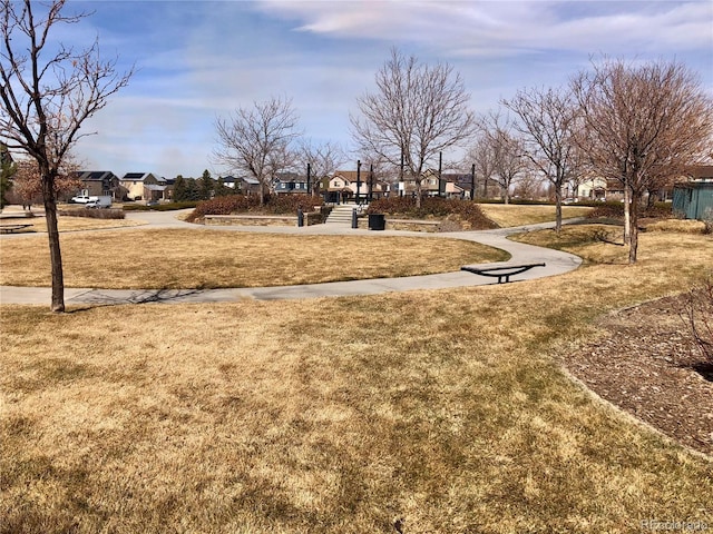 view of community with a residential view and a lawn