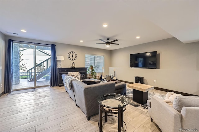16345 Spanish Peak Way, Broomfield, CO 80023 - living area with a ceiling fan, light wood-style flooring, recessed lighting, baseboards, and stairway