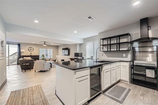 16345 Spanish Peak Way, Broomfield, CO 80023 - kitchen featuring a sink, a ceiling fan, light wood-style flooring, white cabinets, and beverage cooler