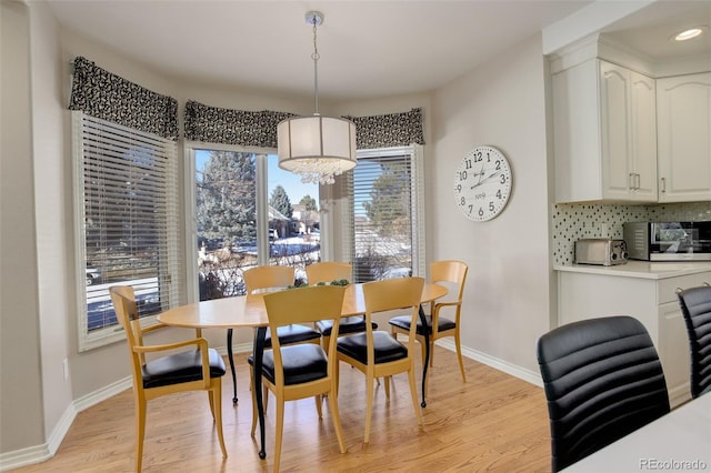 dining room with light wood-type flooring