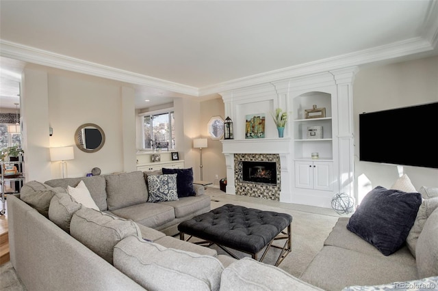 living room with a fireplace, plenty of natural light, and ornamental molding