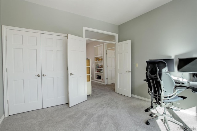 unfurnished office featuring light colored carpet