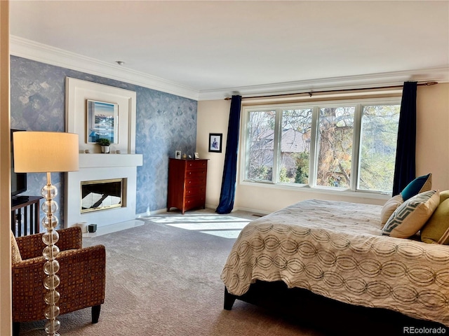 carpeted bedroom featuring ornamental molding and a fireplace