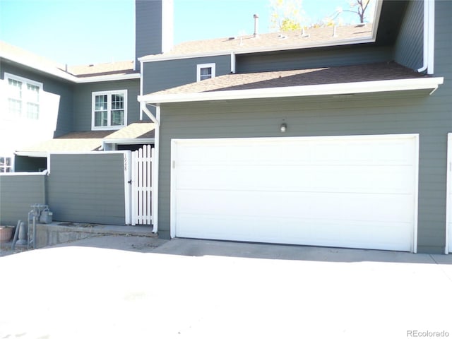 garage with concrete driveway