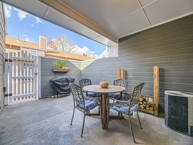 view of patio / terrace featuring fence, outdoor dining space, and area for grilling