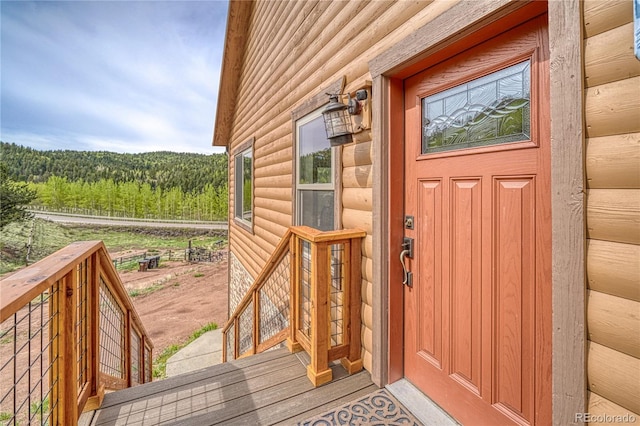 18766 State Highway 67, Divide, CO 80814 - view of exterior entry with a forest view and faux log siding