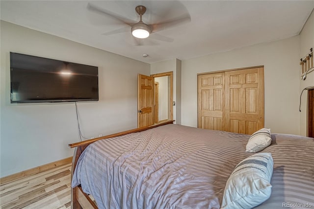 18766 State Highway 67, Divide, CO 80814 - bedroom featuring wood finished floors, a closet, a ceiling fan, and baseboards