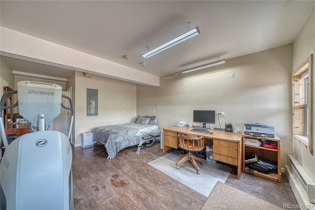 18766 State Highway 67, Divide, CO 80814 - bedroom with electric panel, baseboard heating, wood finished floors, and an office area