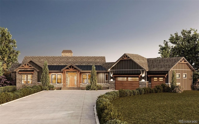 view of front of property featuring driveway, stone siding, metal roof, a standing seam roof, and board and batten siding