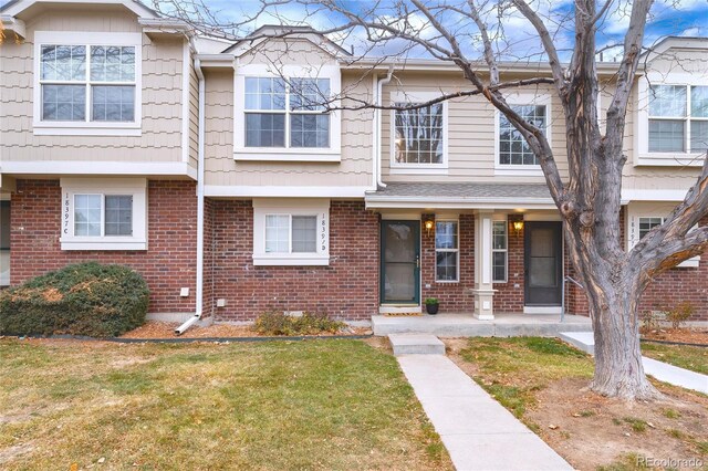 18397 E Alabama Pl Unit D, Aurora, CO 80017 - multi unit property with brick siding and a front lawn
