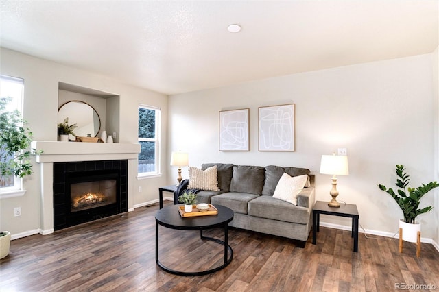 18397 E Alabama Pl Unit D, Aurora, CO 80017 - living room with plenty of natural light, wood finished floors, and a tiled fireplace