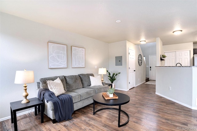 18397 E Alabama Pl Unit D, Aurora, CO 80017 - living area featuring baseboards, wood finished floors, and electric panel