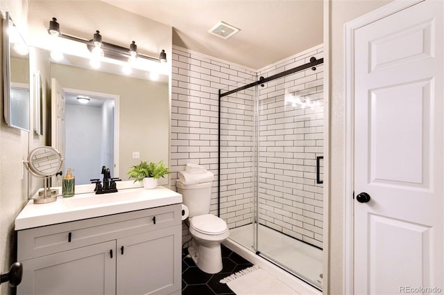 18397 E Alabama Pl Unit D, Aurora, CO 80017 - full bath featuring a shower stall, tile patterned floors, toilet, and vanity