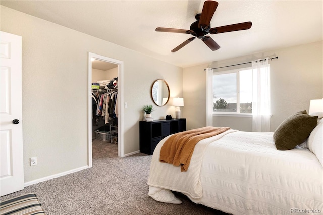 18397 E Alabama Pl Unit D, Aurora, CO 80017 - carpeted bedroom with a walk in closet, baseboards, a closet, and a ceiling fan