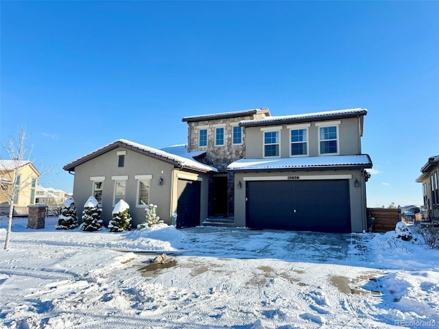 view of front of property with a garage