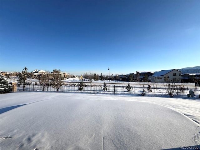 view of yard layered in snow