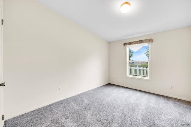 7725 Hummingbird Grn Unit 78, Frederick, CO 80530 - carpeted spare room featuring baseboards