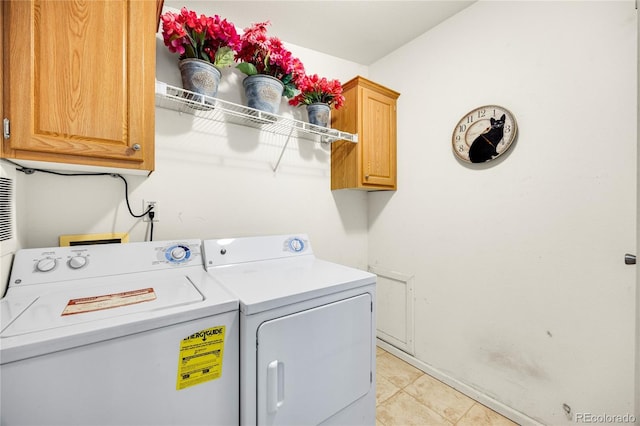 7725 Hummingbird Grn Unit 78, Frederick, CO 80530 - laundry room with washer and dryer, cabinet space, light tile patterned flooring, and baseboards