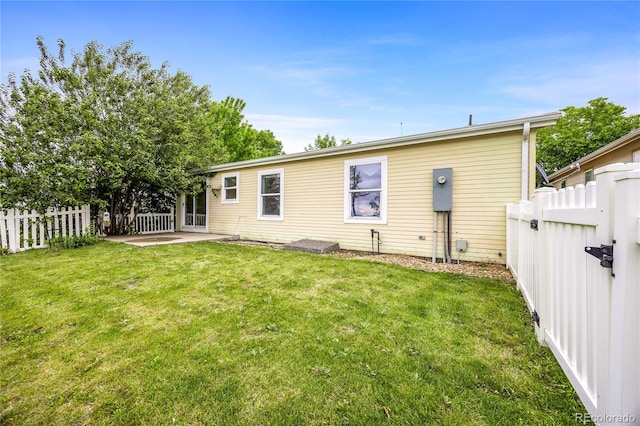 7725 Hummingbird Grn Unit 78, Frederick, CO 80530 - rear view of property with a patio